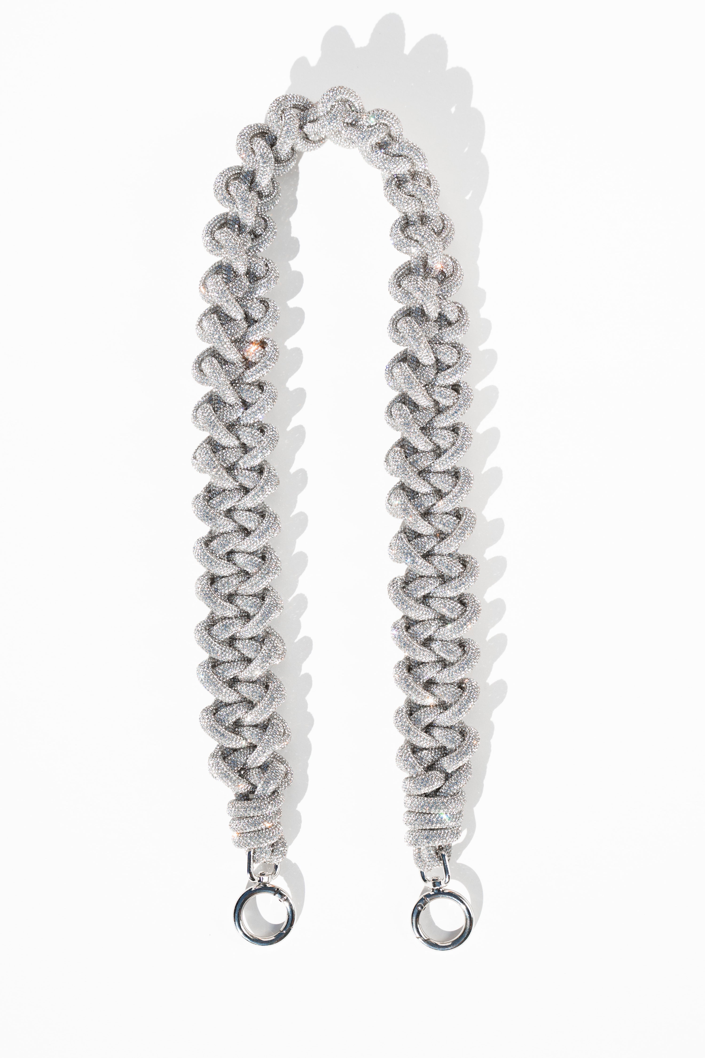 Black leather lace strap with metal hooks designed to attach to bags