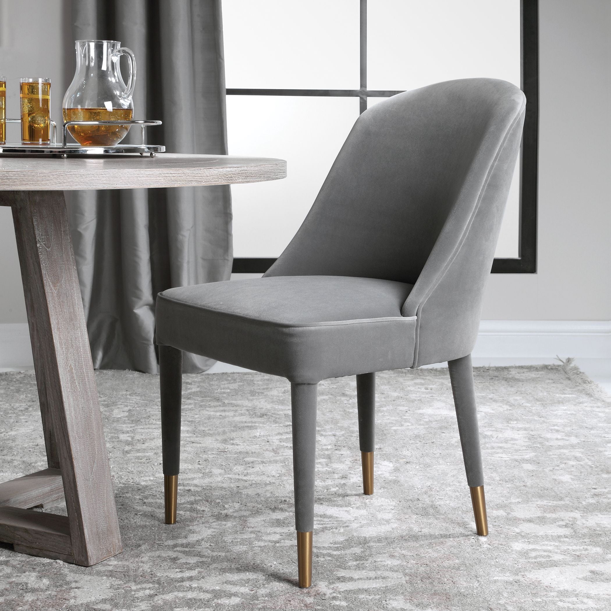 Gray Brie armless chair with curved wooden legs