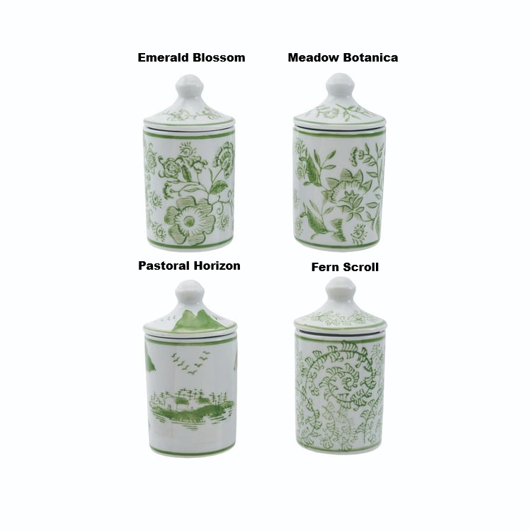 Four hand-stamped green and white stoneware spice jars in floral, landscape, and scroll patterns.
