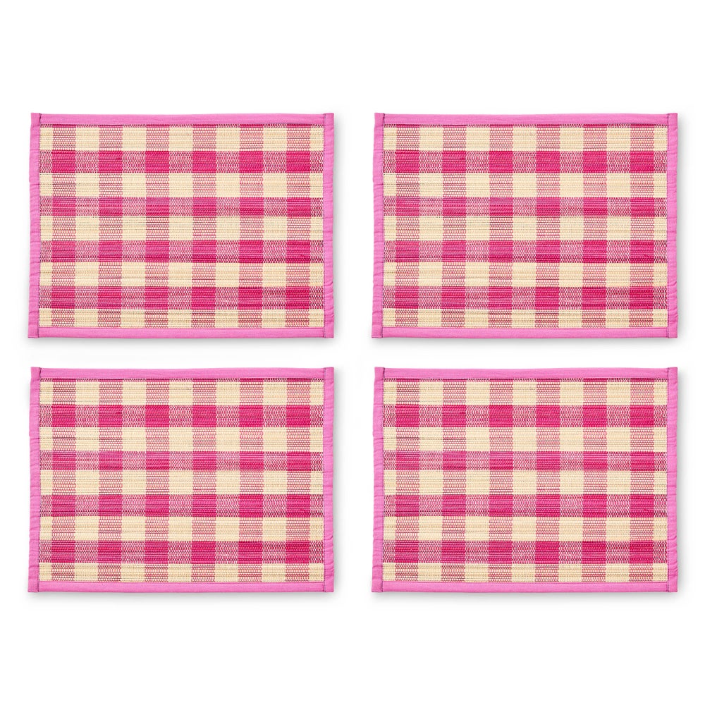 Set of four pink and cream woven check straw placemats with pink cotton borders.