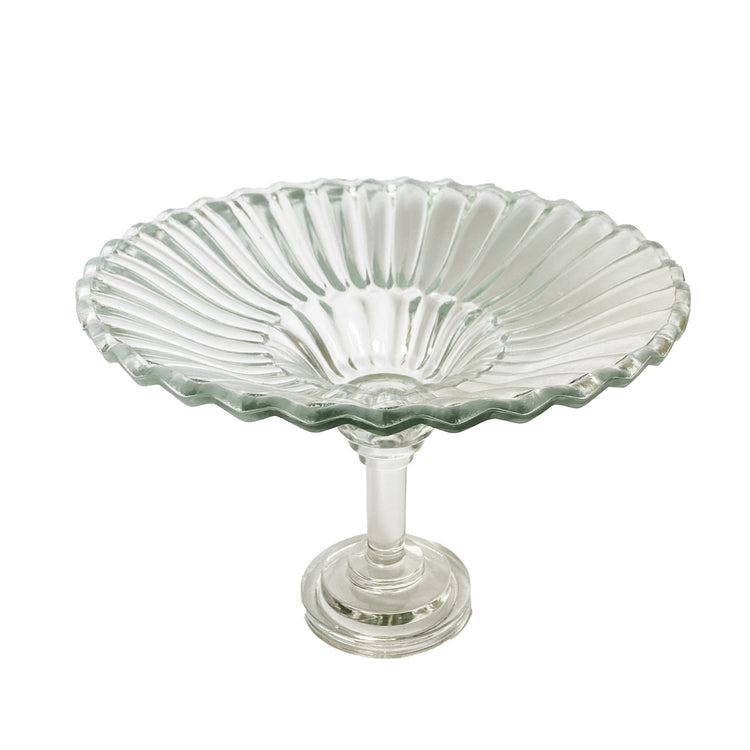 Clear pressed glass pedestal bowl with a fluted, scalloped rim on a tall stem and circular base.