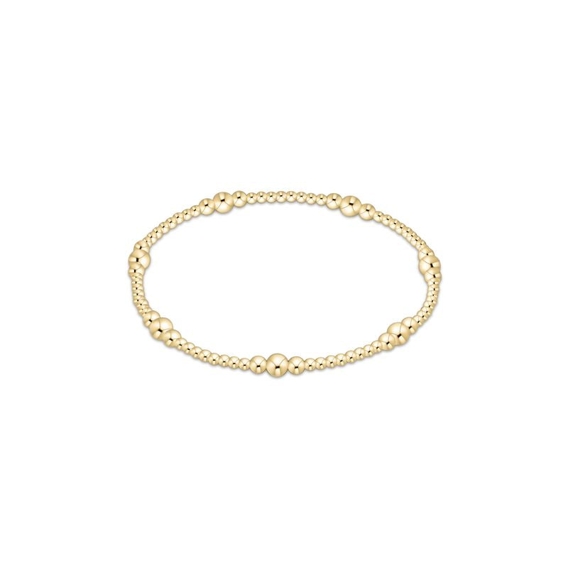 Polished gold bead bracelet with a sleek stacked design