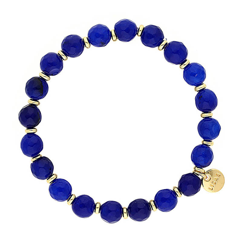 Lizas Beaumont Natural Bracelet featuring faceted blue stones with gold-toned spacers and logo charm.