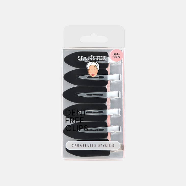 Black creaseless hair clip with a smooth silicone grip holding brown hair.