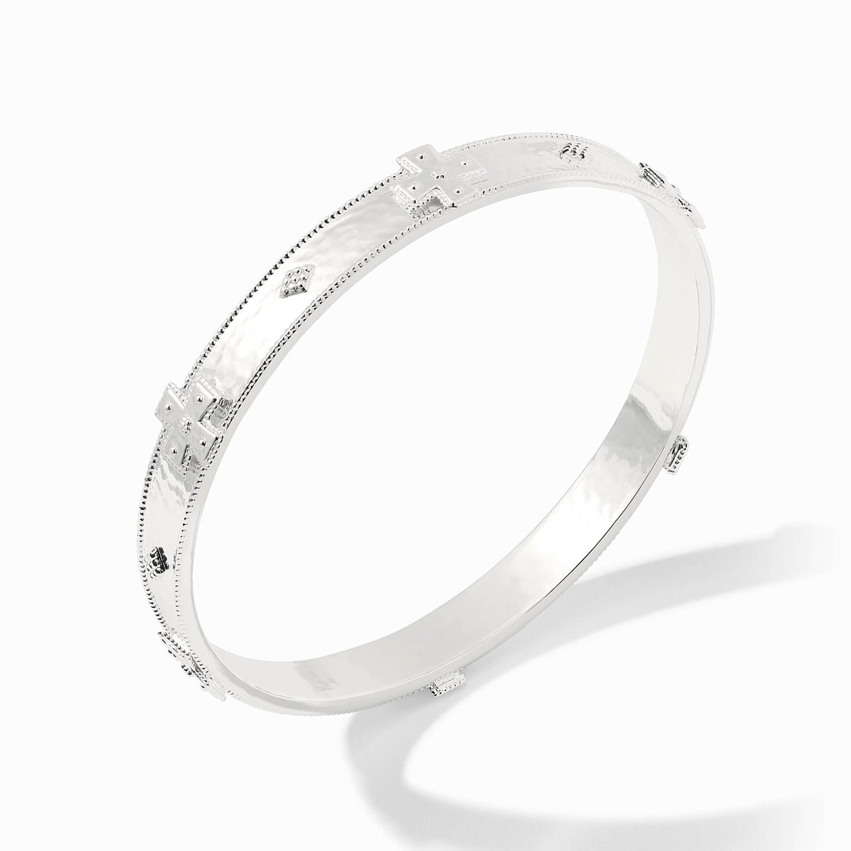 Canterbury bangle in gold-tone metal with a smooth polished finish.