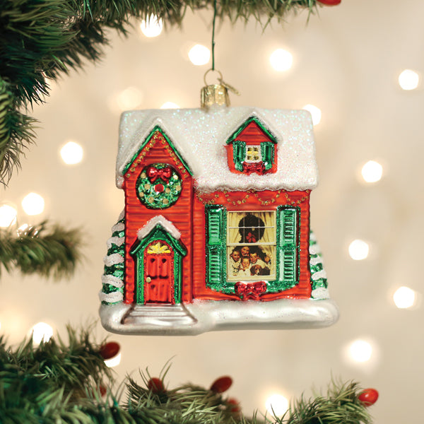 Norman Rockwell You're Home! glass house ornament with a family photo in the window on a tree.