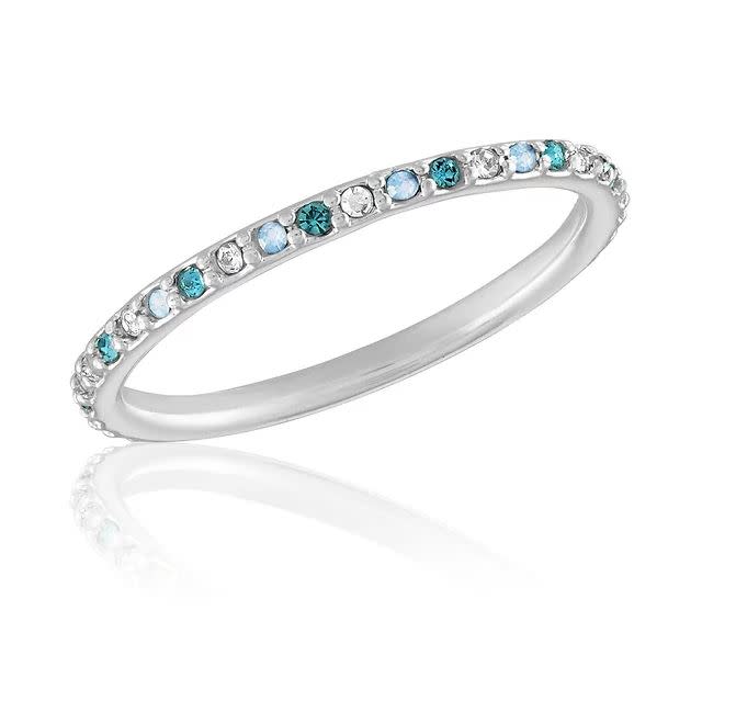Thin aquamarine mix diamond stack ring featuring a delicate band with small blue stones and clear diamonds in an elegant silhouette.