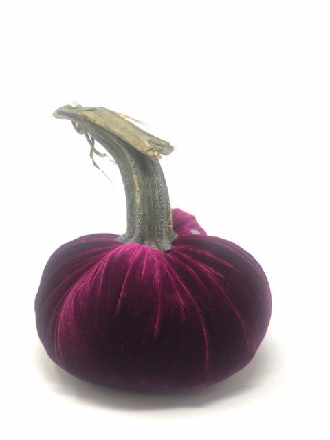 Handmade velvet pumpkin in deep orange with a natural stem.