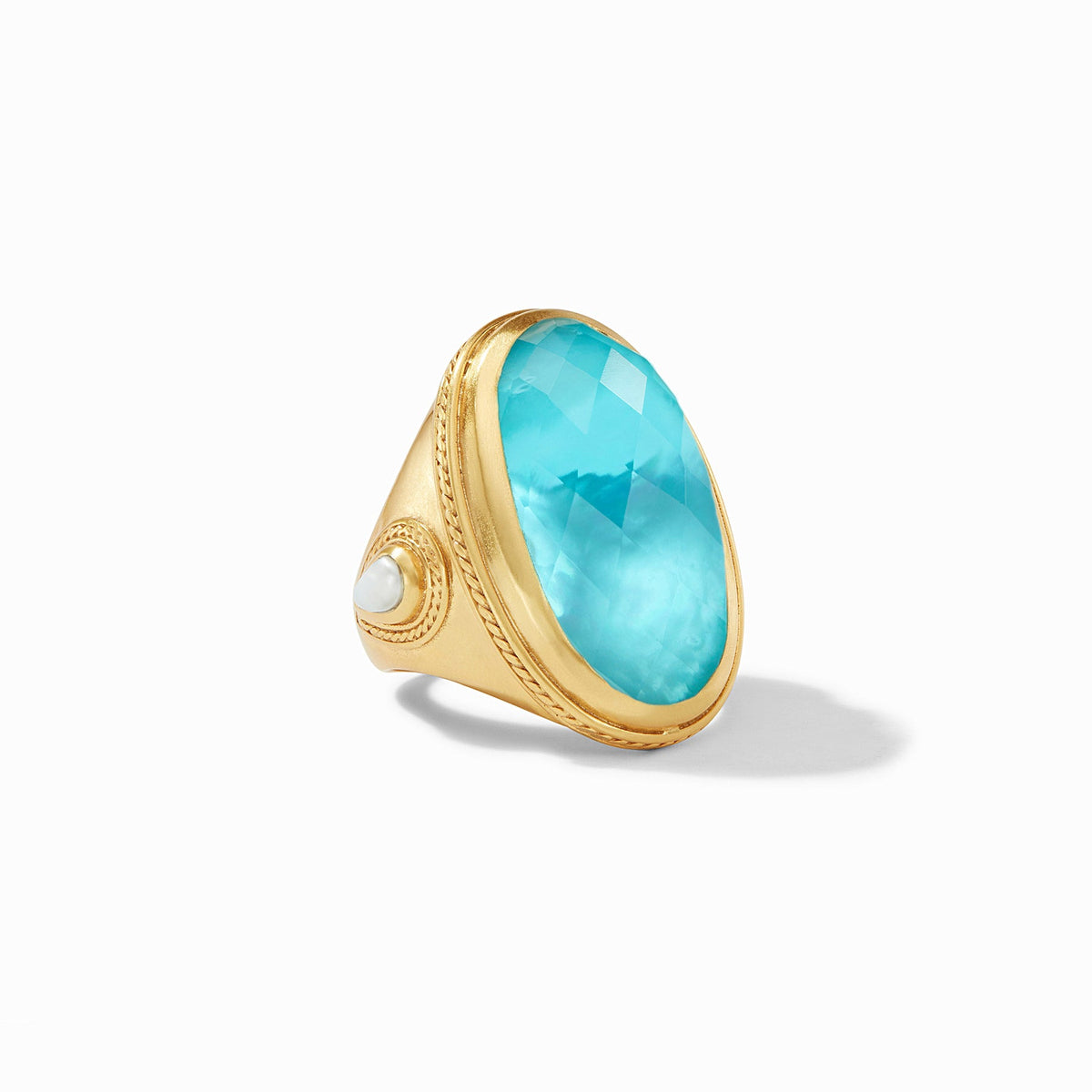 Gold-plated Cannes statement ring featuring a pear-shaped gemstone with mother-of-pearl accents and twisted wire detail.