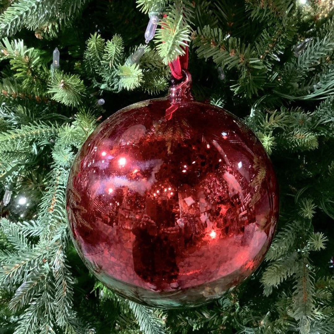 150mm hand-blown mercury glass ornament in vintage burgundy hanging on a green Christmas tree.