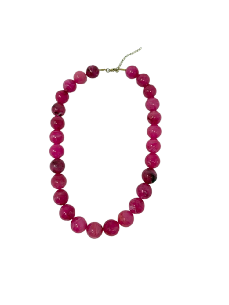 Chunky pink bead statement necklace with marbled patterns and a gold-tone adjustable chain.