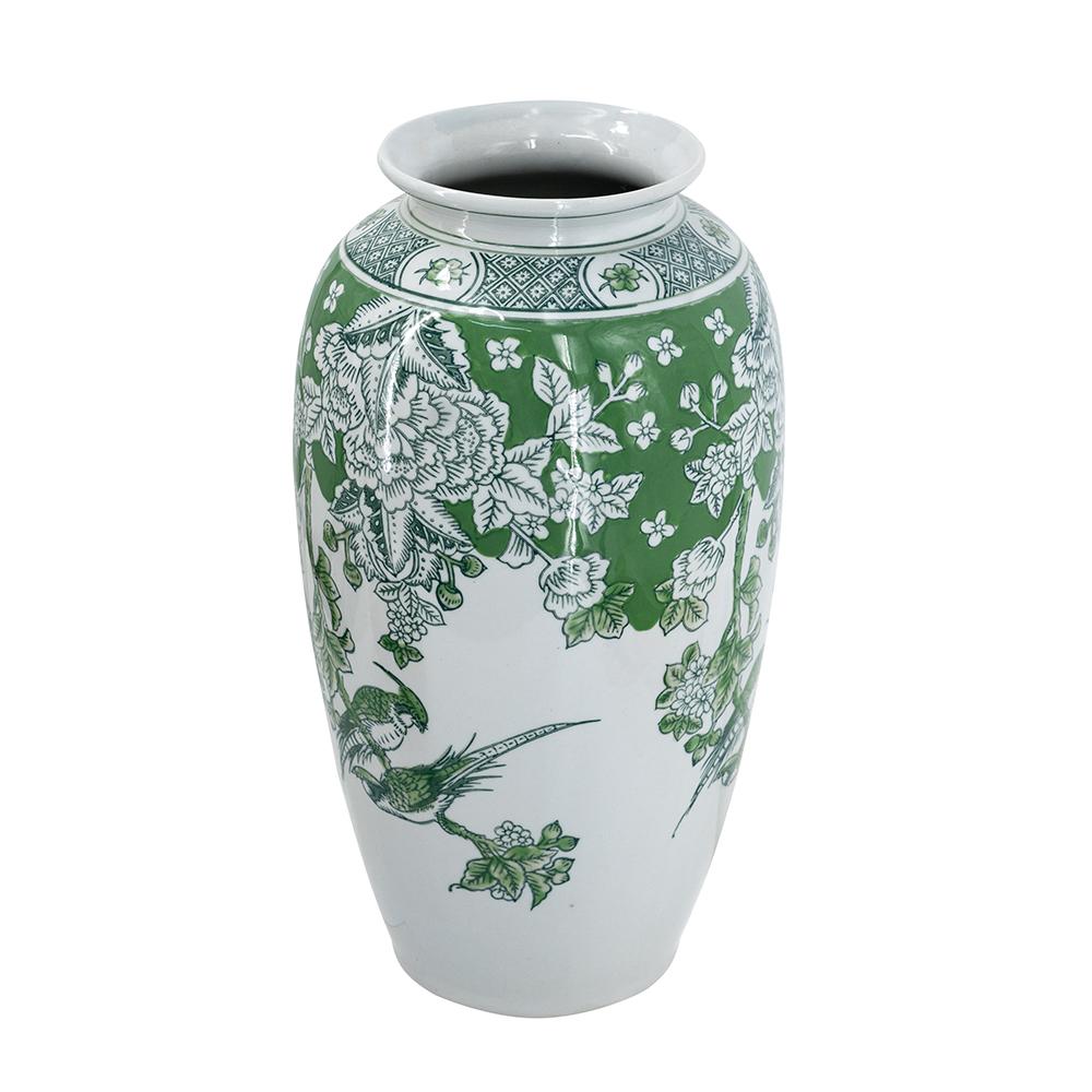 Green white porcelain vase with tapered silhouette featuring intricate green floral and bird motifs on a crisp background.