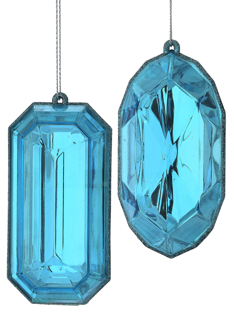 Two blue acrylic gem-shaped ornaments with faceted surfaces and glittered edges.