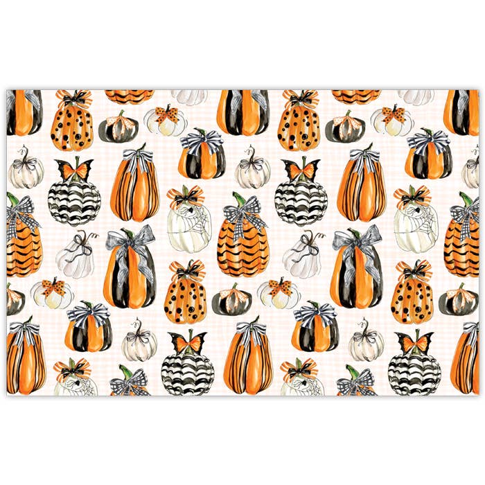 Handpainted placemat featuring orange pumpkins with bows on a neutral background.