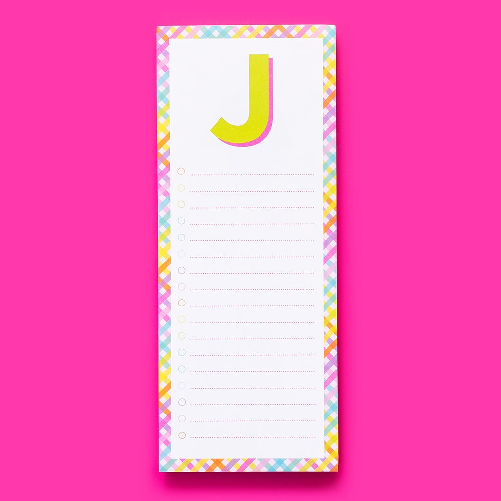 List Pad Letters: a white magnetic memo pad with blue lines on the front.