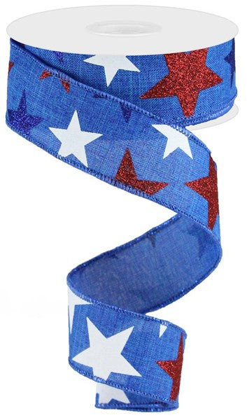 1.5 inch blue royal ribbon with white and red glitter stars on a white spool.