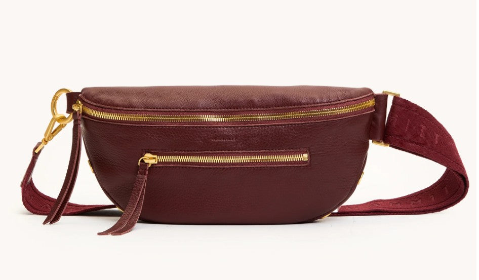 Charles Crossbody Med in burgundy leather with gold zippers and an adjustable fabric strap.