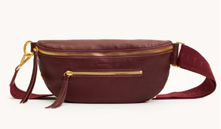 Charles Crossbody Med in burgundy leather with gold zippers and an adjustable fabric strap.