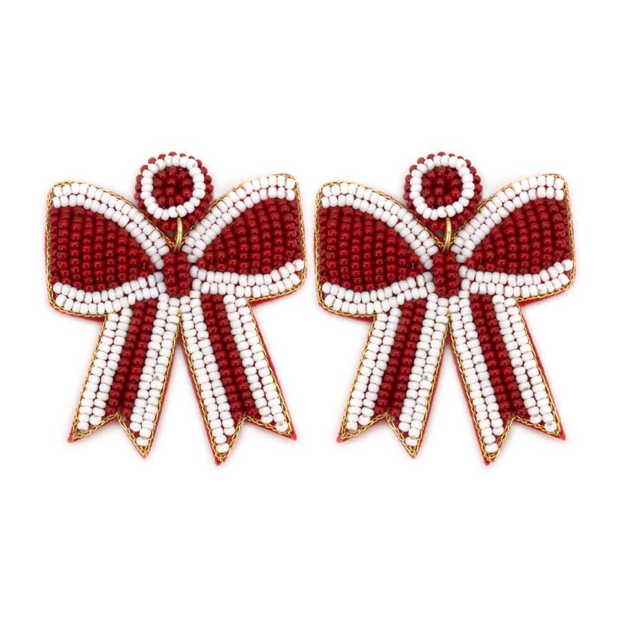 Pair of beaded bow-shaped earrings in red and white stripes with gold-tone trim.