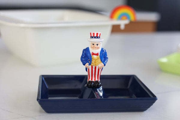 Mini Uncle Sam patriotic figure in red, white, and blue with stars and stripes pattern.