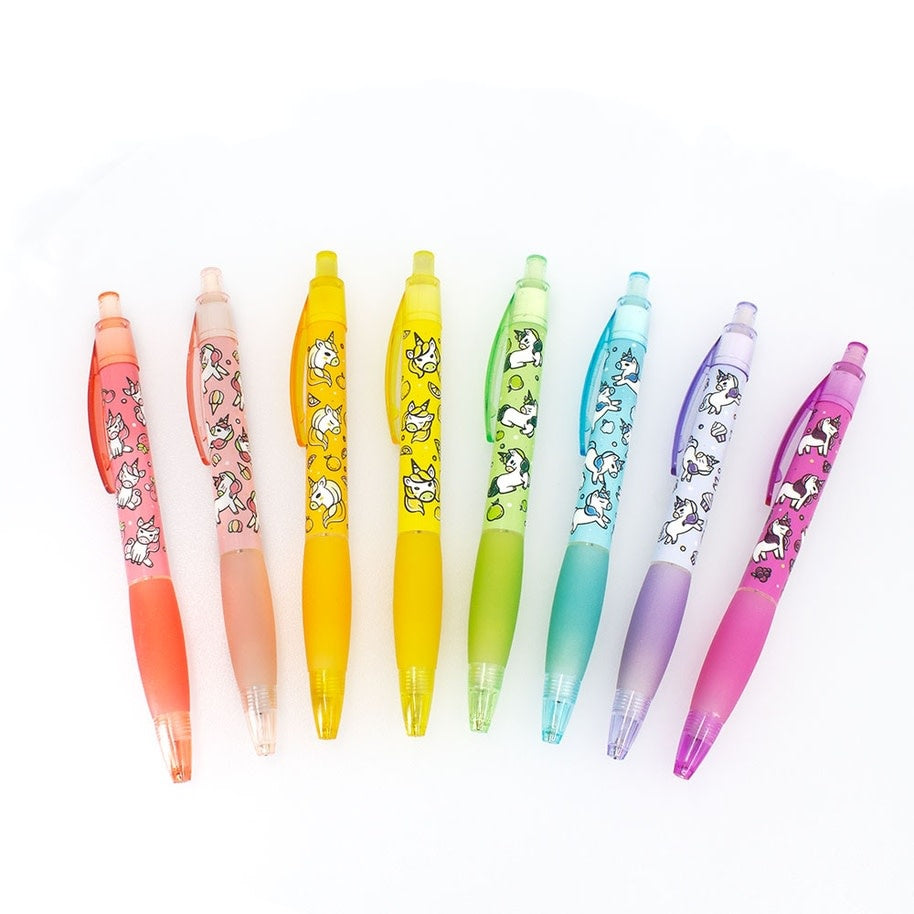Set of eight mechanical pencils with unicorn grip patterns in pastel colors.