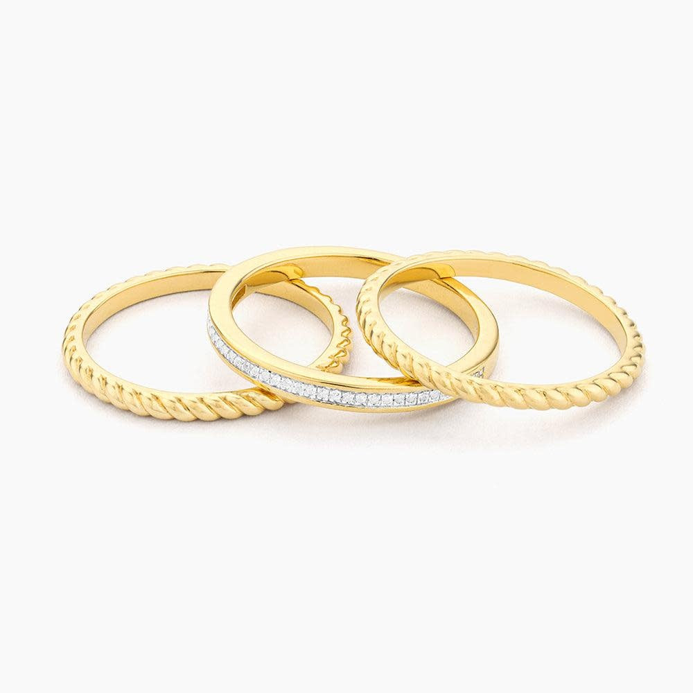 Front view of a Unite stackable ring in gold-plated sterling silver with a small diamond accent.