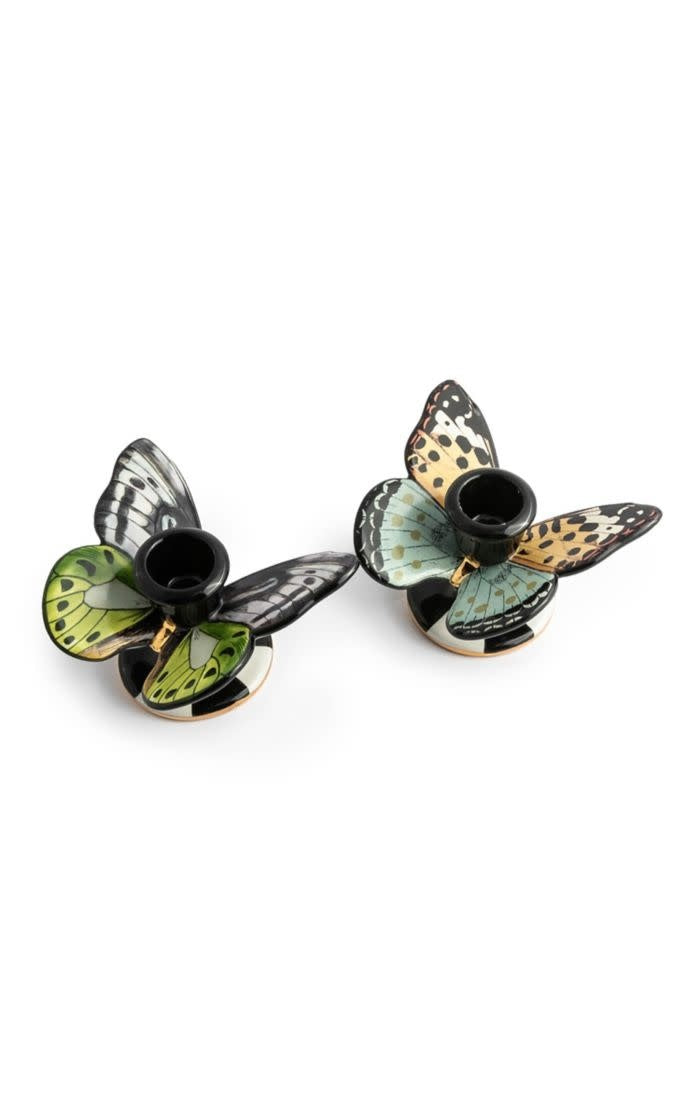 Ceramic butterfly-shaped candle holder with a delicate winged silhouette in neutral tones.