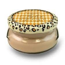 3.4oz Tyler candle in a glass jar with a tan wax blend and a leopard print lid.