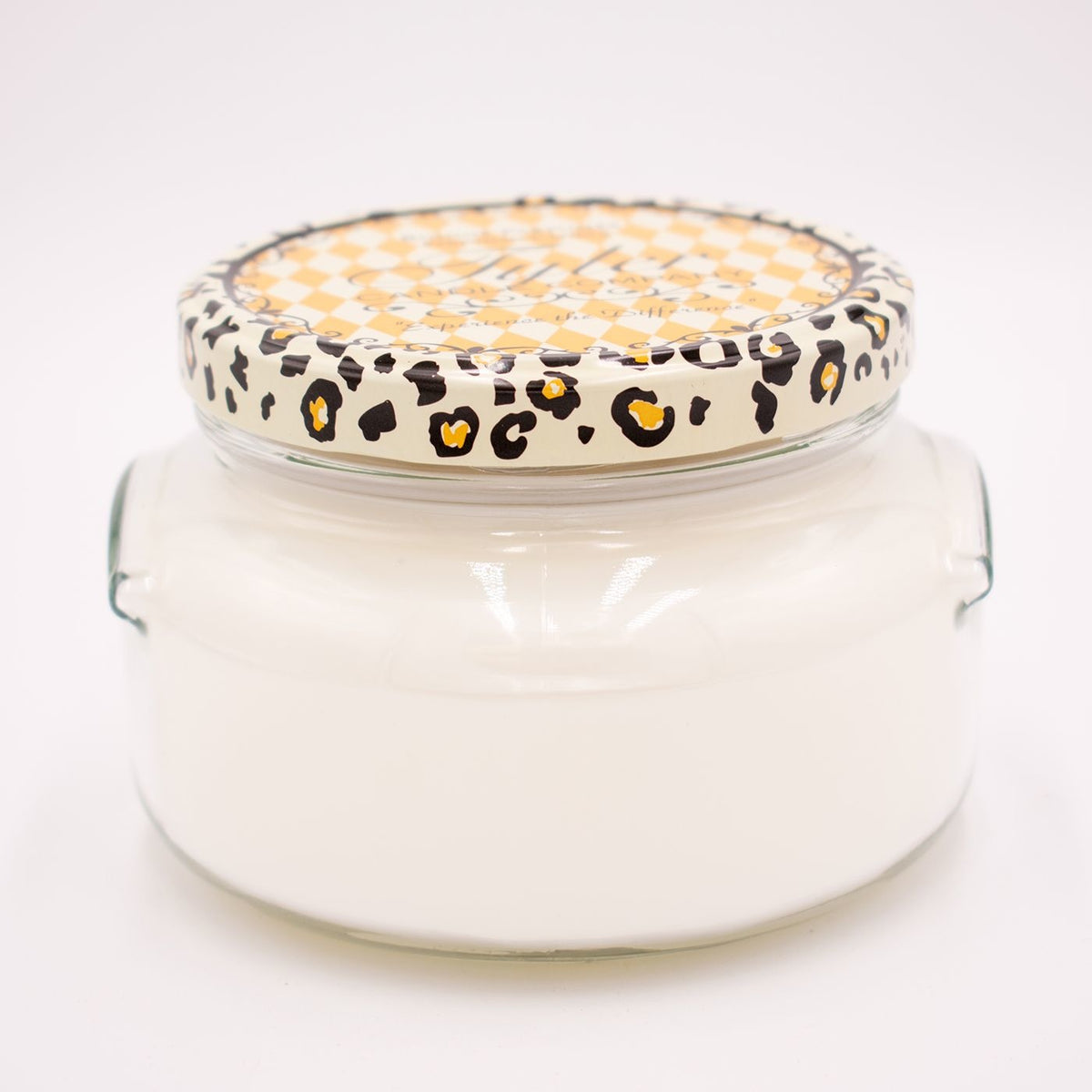 A white ceramic jar containing a Tyler Candle with visible wicks inside.