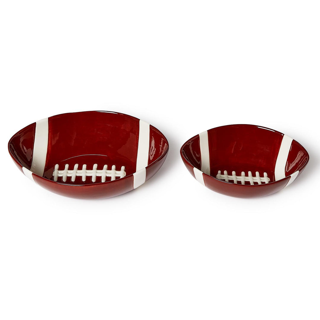 Two football-shaped ceramic tidbit bowls in different sizes with red glaze and white lace details.