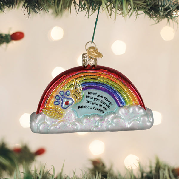 Heart-shaped ornament with pawprint designs in a soft pastel color palette.