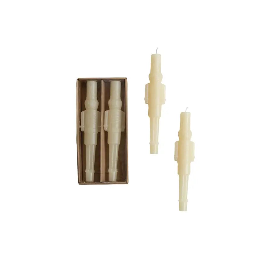Unscented ivory taper candle shaped like a classic nutcracker soldier silhouette.