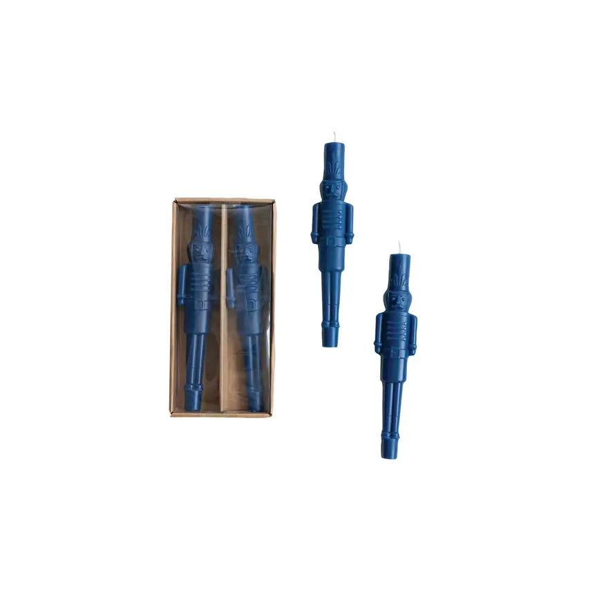 Navy blue unscented taper candle shaped like a classic nutcracker soldier.