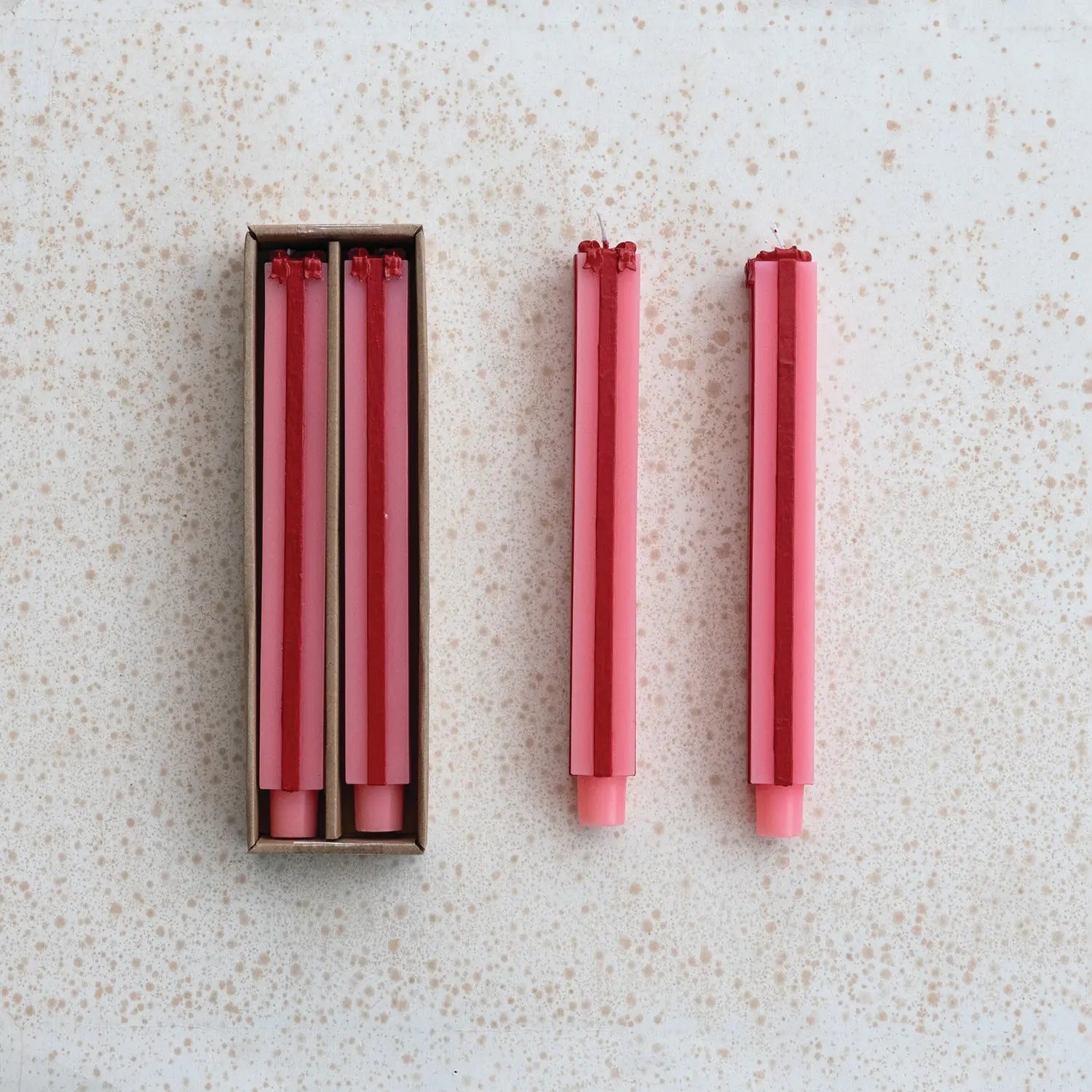 Pink unscented package-shaped taper candle with gift-box detailing