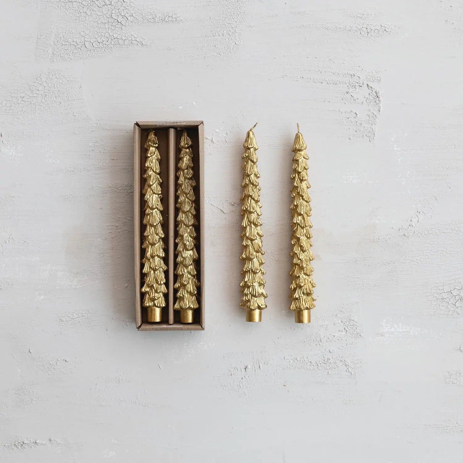 Set of gold unscented taper candles sculpted into a tree shape with tapered silhouette.