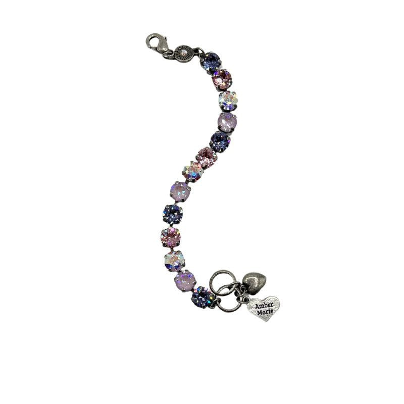 Classic Paris bracelet featuring lavender, lilac, white, and light green stones with an amber tag heart charm.
