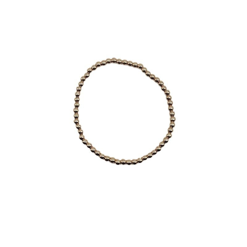 Small water-resistant bead bracelet with a simple round link chain in neutral tone.
