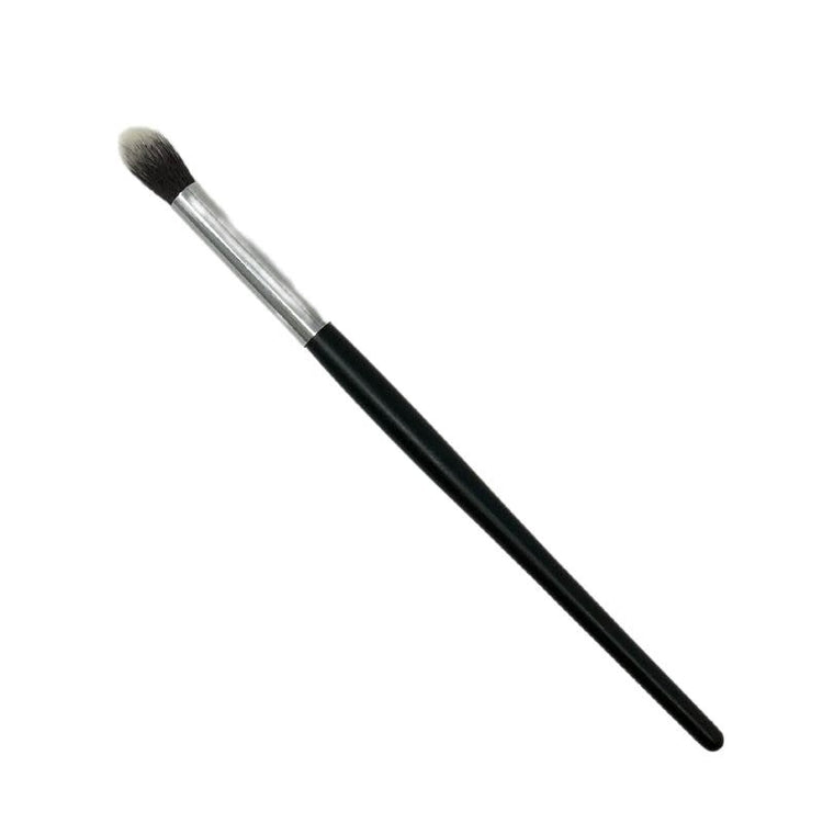 Makeup eye brush with a black handle and silver ferrule featuring soft, tapered bristles.