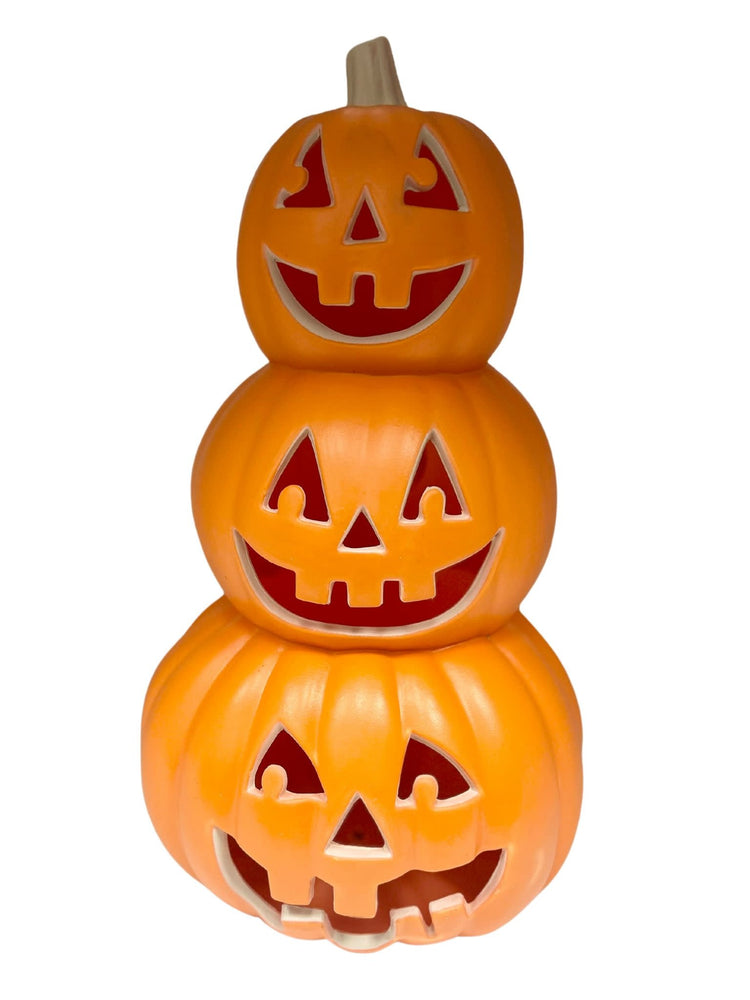 Stacked Halloween pumpkin decor in orange with black stem accents