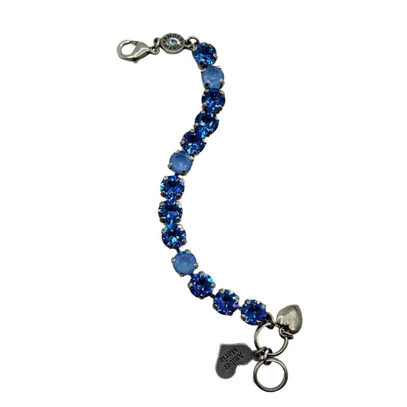 Classic Santorini bracelet featuring blue ombre stones, an amber tag with a crystal, and a Scotty dog heart charm.