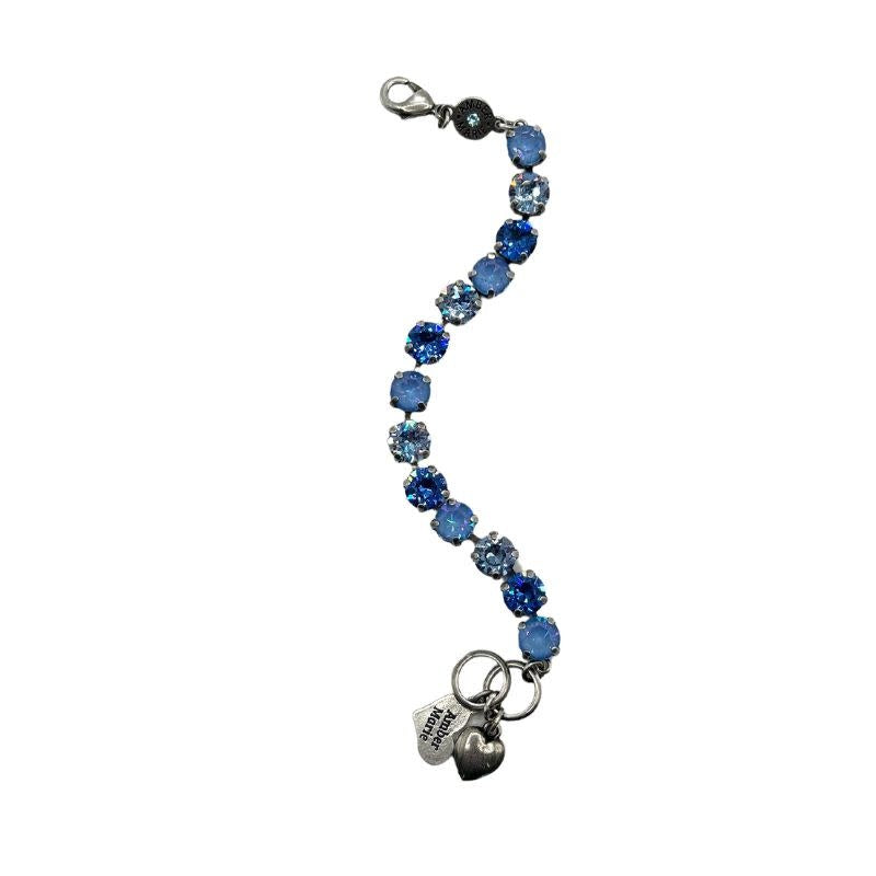 Classic Santorini bracelet featuring blue ombre stones, an amber tag with a crystal, and a Scotty dog heart charm.