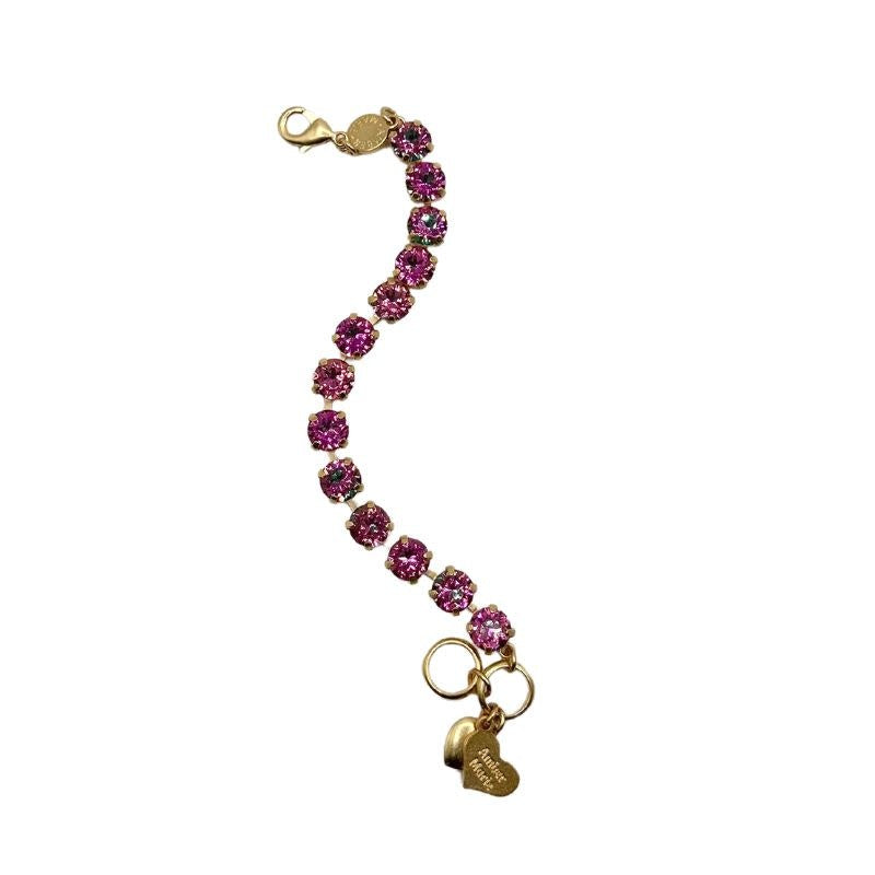 Classic bracelet featuring green, yellow, purple stones with an amber tag heart charm