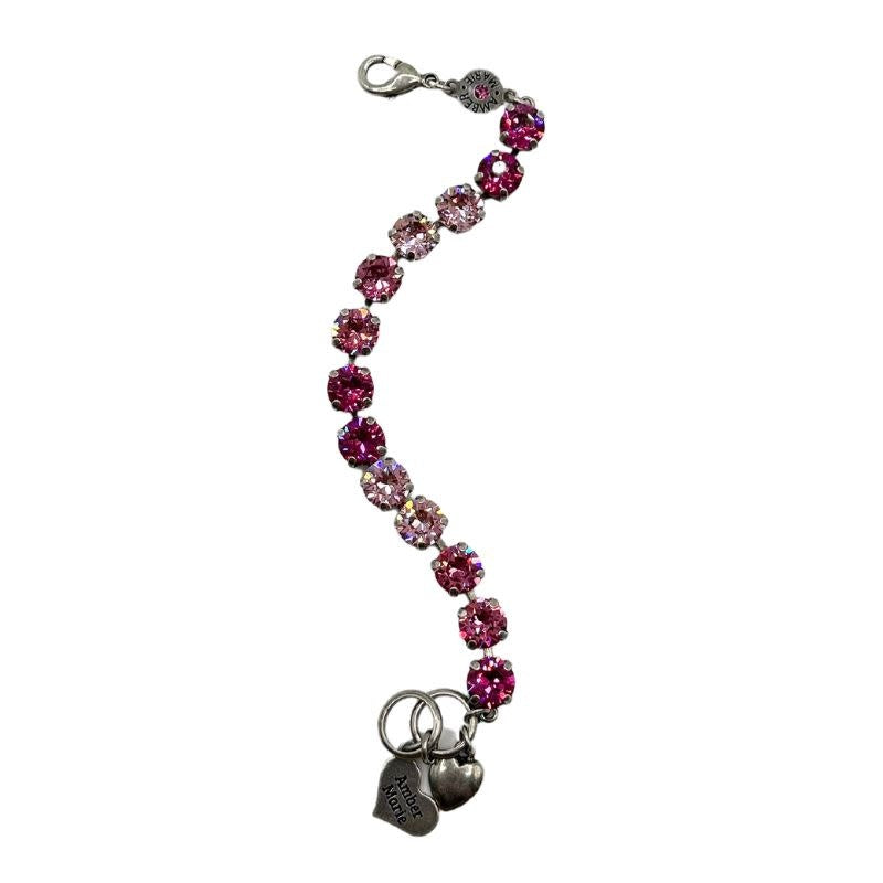 Classic Milan bracelet featuring a row of pink crystals and two small heart charms.