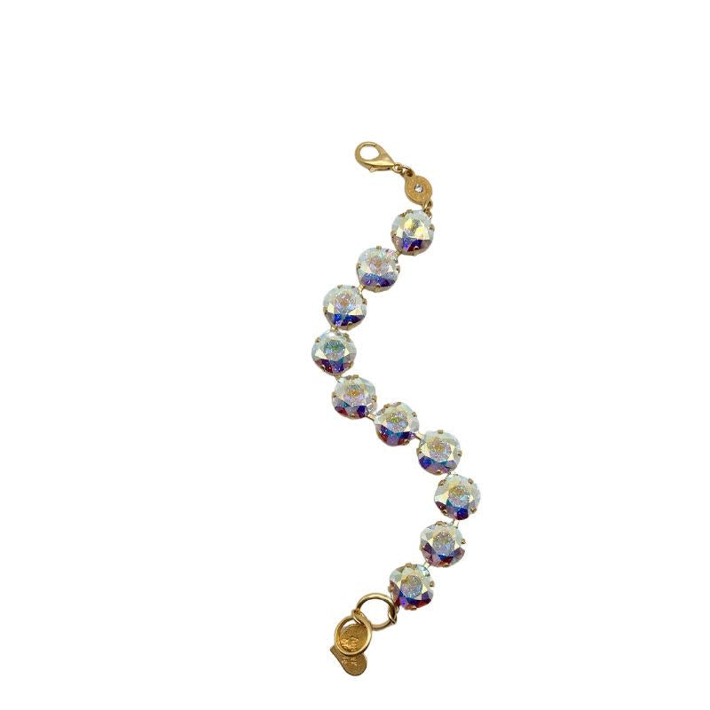 Jere Gold Medium Deluxe Cushion Cut Sitllwater ring featuring a cushion-cut gemstone in gold setting.