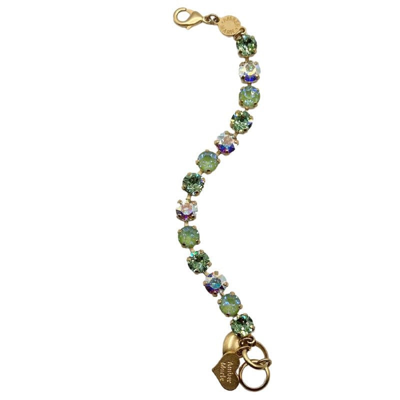 Green collage bracelet with amber tag, crystal accents, Scotty dog heart charm, adjustable length.