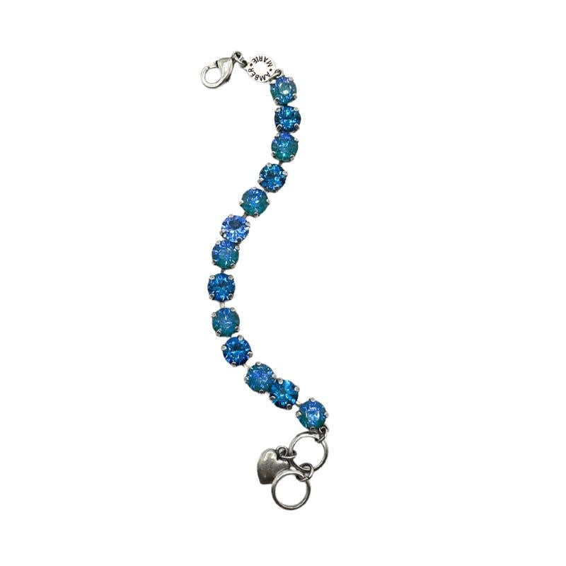 Classic Santorini bracelet featuring blue ombre stones, amber tag with crystal, and Scotty dog heart charm.
