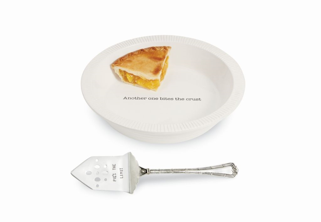 Ceramic pie plate with fluted rim paired with a stamped silverplate server.