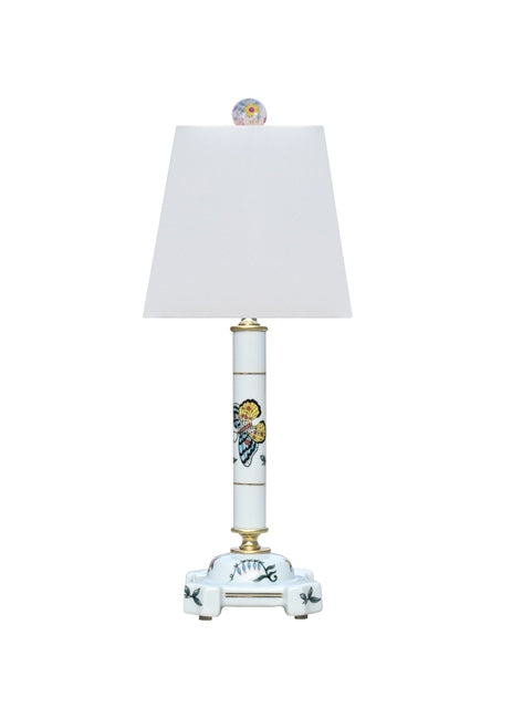 White porcelain butterfly-shaped lamp with delicate wing patterns.