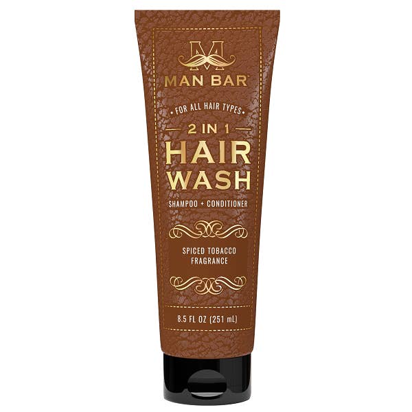 Man Bar two-in-one hair wash bottle with blue liquid visible through clear plastic packaging