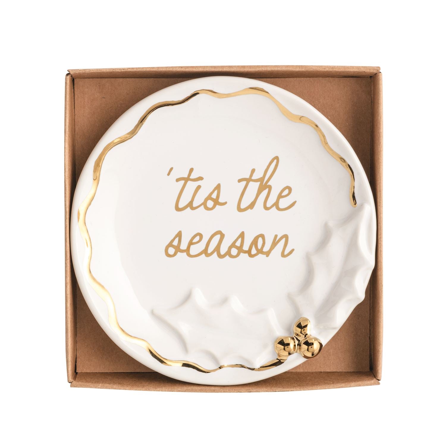 White stoneware trinket dish with gold 'tis the season text and raised holly motif in a brown box.